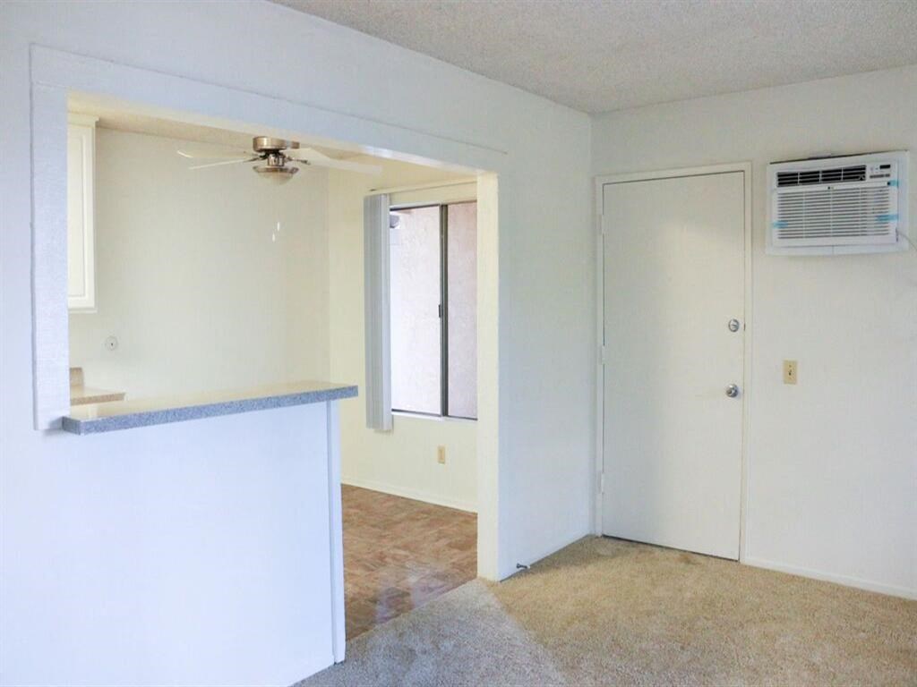 an empty room with an air conditioner in it