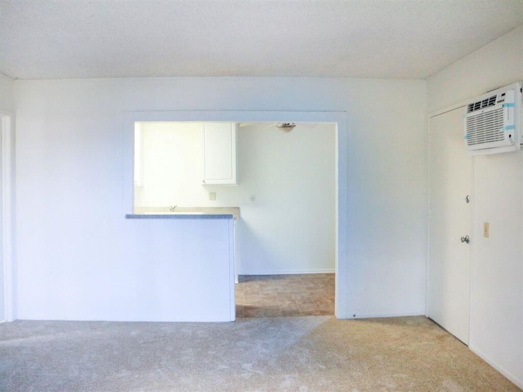 an empty room with an air conditioner in it
