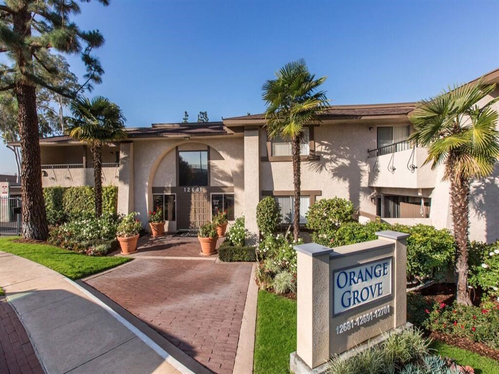 a building with an orange grove sign in front of it