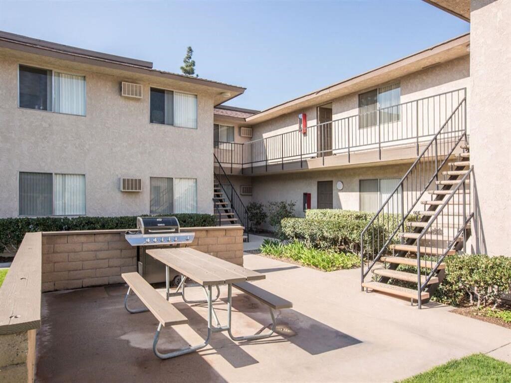 a picnic table in front of a building