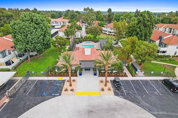an aerial view of a house with a basketball court and palm trees at The Park Apartments, Rancho Cucamonga,California, 91730