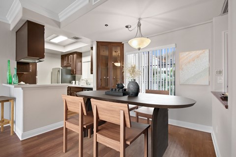 an open kitchen and dining room with a table and chairs