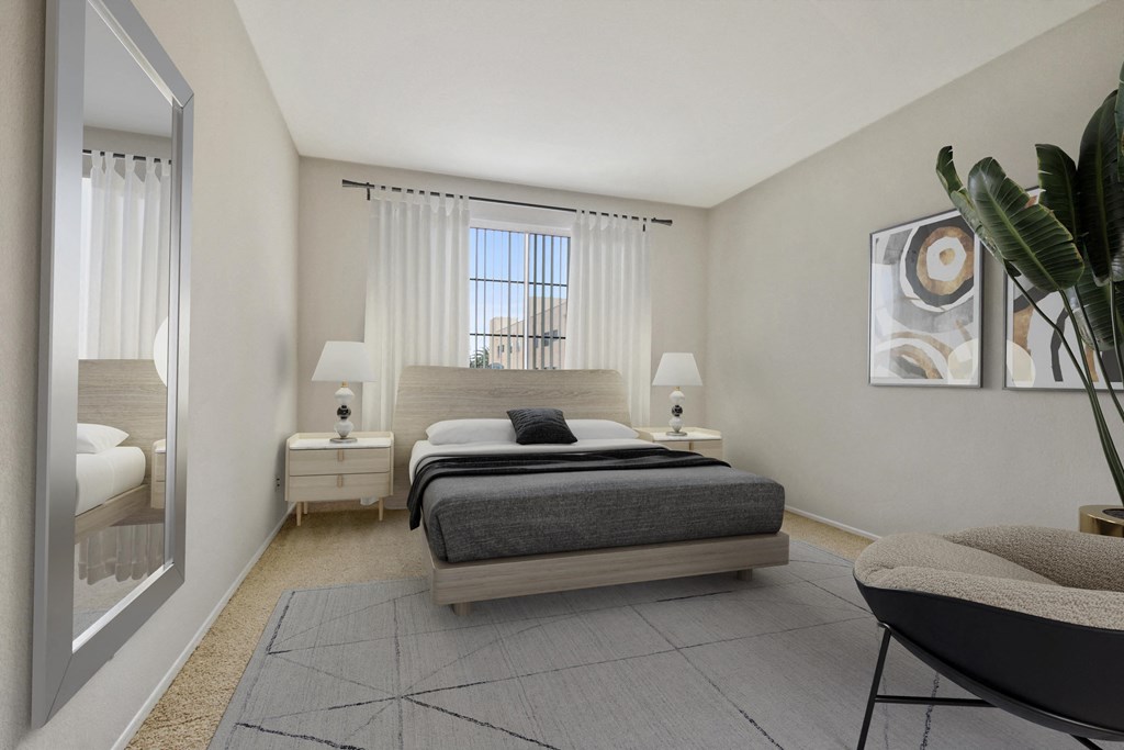a bedroom with a bed and a mirror and a window at Darlington Apartments, Los Angeles