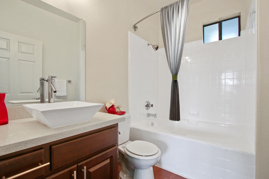 a bathroom with a sink and a toilet and a shower at Darlington Apartments, Los Angeles, CA