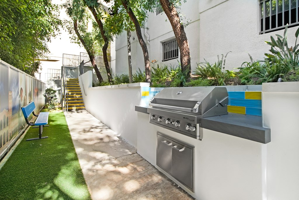 A modern outdoor kitchen with a grill and oven. at 433 Midvale - Student Housing at UCLA, Los Angeles, 90024