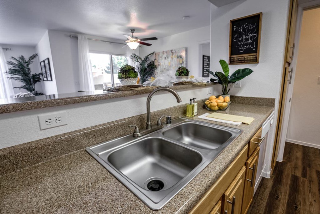 a kitchen with a sink and a counter top at Bella Terra Apartments, Henderson, NV, 89012