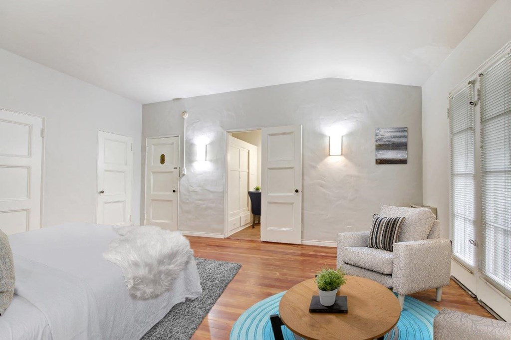 a bedroom with a bed and a chair  at 1022 Tiverton, Los Angeles, California