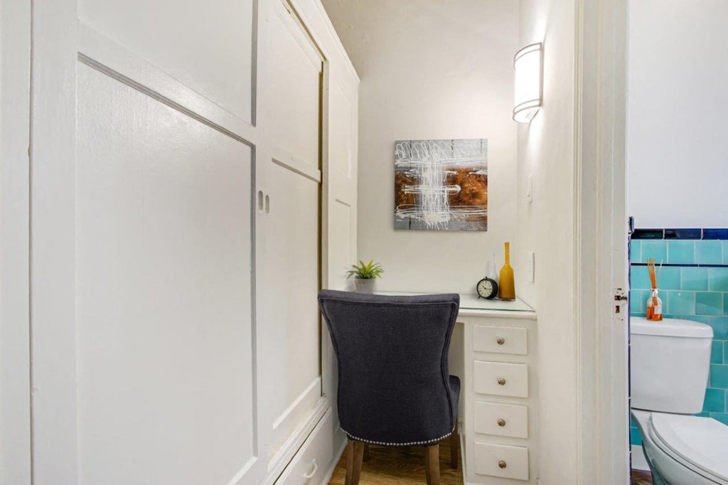 a small desk in a bathroom next to a toilet  at 1022 Tiverton, Los Angeles, 90024