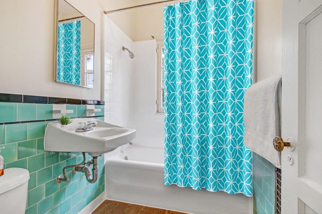 a bathroom with a sink and a bathtub  at 1022 Tiverton, Los Angeles, 90024