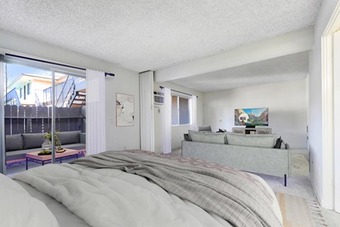 A bedroom with a large bed and a painting on the wall.