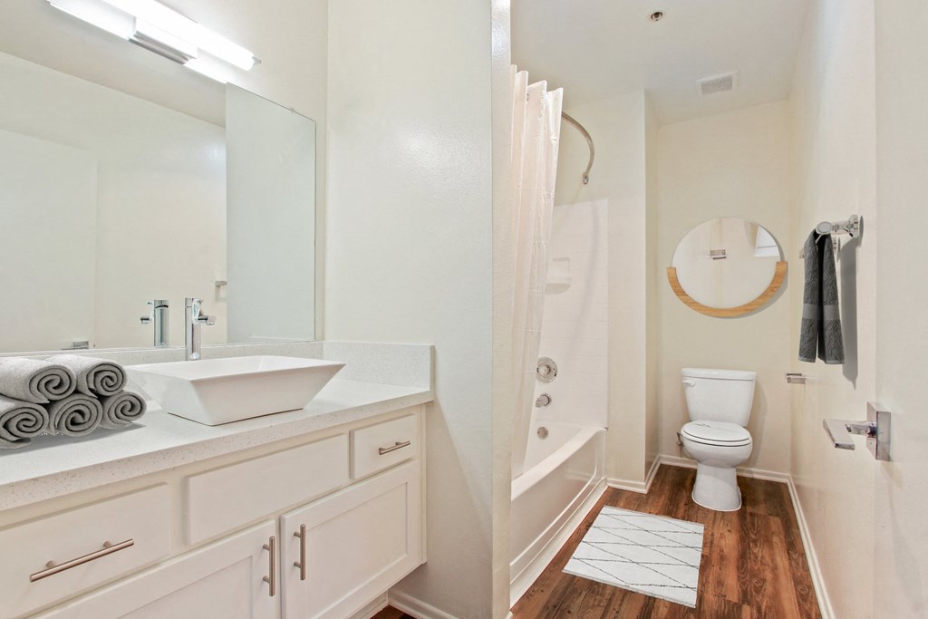 a bathroom with a sink and a shower and a toilet at Palm Royale Apartments, Los Angeles, CA