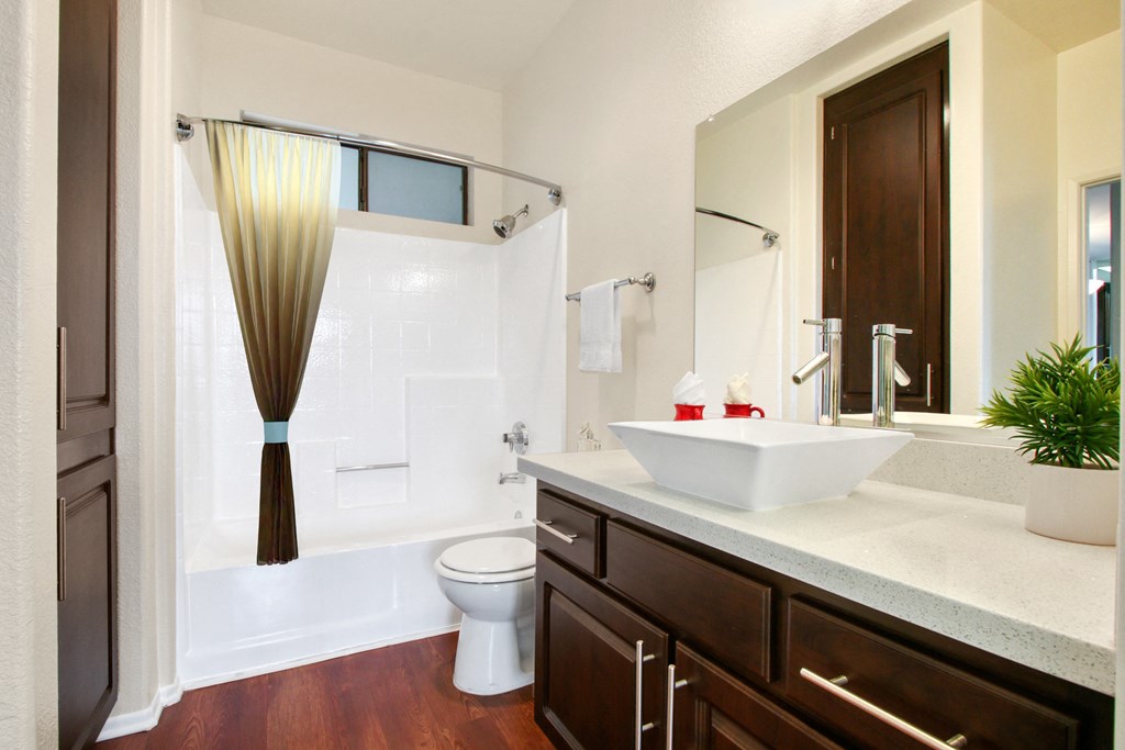 a bathroom with a sink and a toilet and a shower at Darlington Apartments, Los Angeles, CA