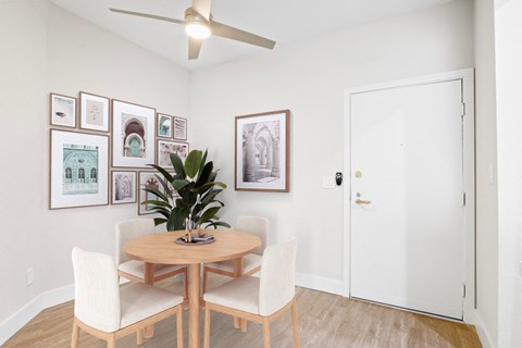 a dining room with a table and chairs and a ceiling fan at Playa Summit, California, 90045