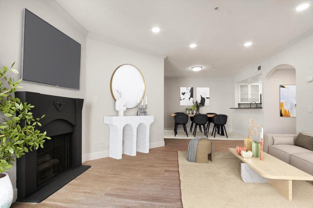 a living room with a fireplace and a tv at Burton, Los Angeles