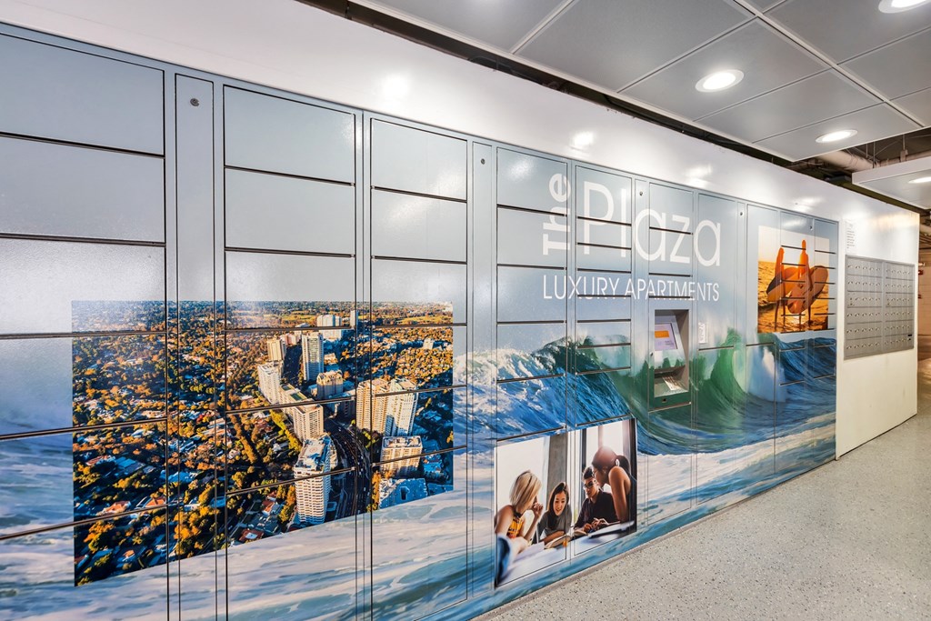 a wall with a large mural of a city on it  at The Plaza Apartments, Los Angeles, CA