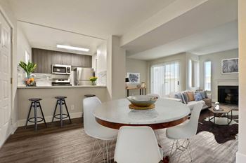 Dining table chair and kitchen at Alon Apartments, California, 90034