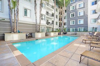 Swimming Pool With Lounge Chairs at Apex Mission Valley, San Diego