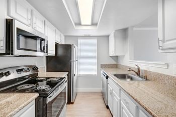 Electric Range In Kitchen at The Park Apartments, Rancho Cucamonga, CA 91730