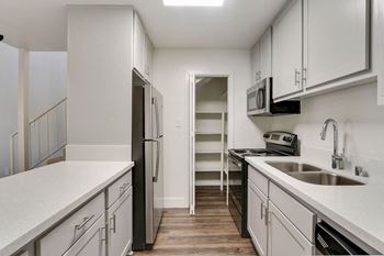 Kitchen and storage cabinet at Meridian Apartments, California, 90066