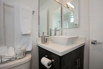 Bath and mirror at Midvale Apartments, Los Angeles, CA