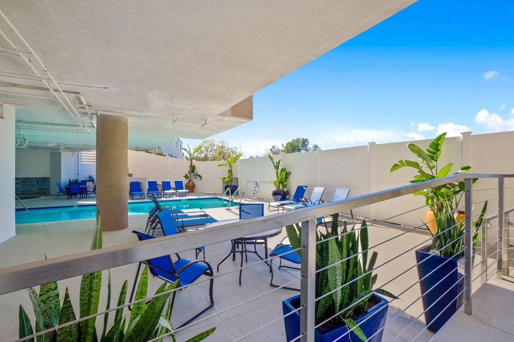 Pool side sitting area1at Midvale Apartments, California, 90024