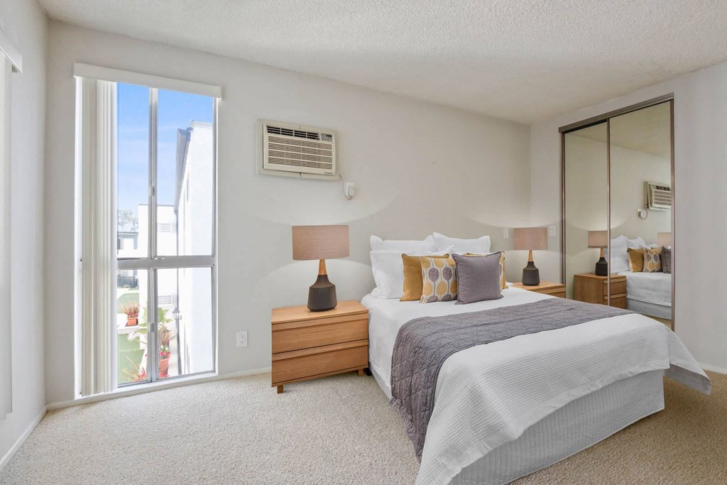 Bedroom white interior with bed at Rose Apartments, Los Angeles, CA, 90034