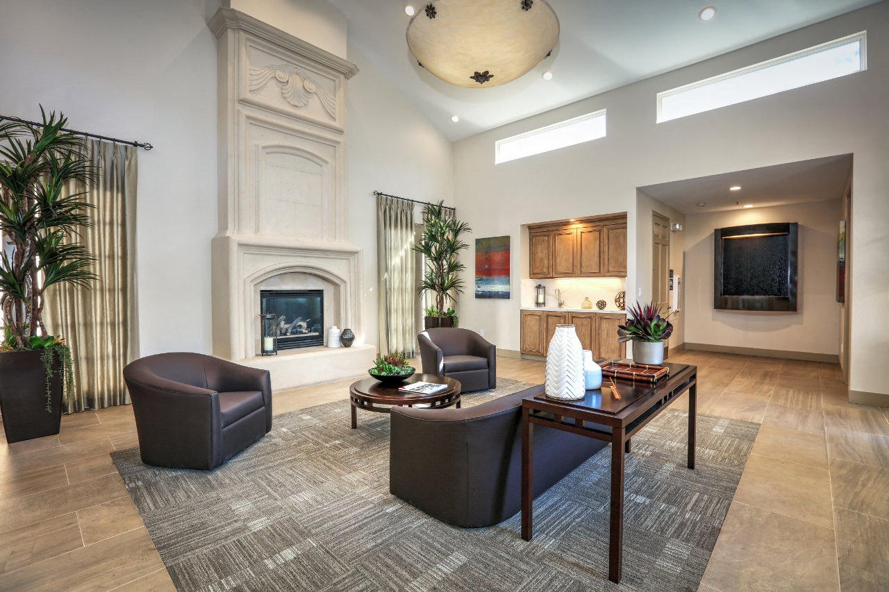 a living room with a fireplace and a table