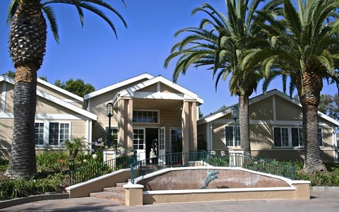 a house with palm trees in front of it