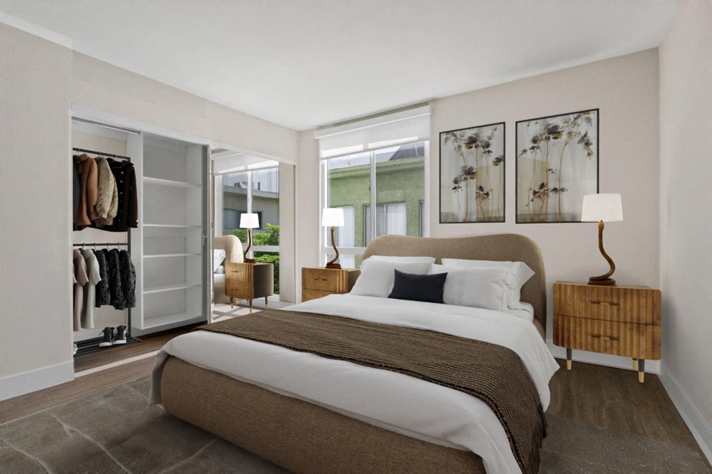 A bedroom with a large bed and a wardrobe at Rochester Apartments, California