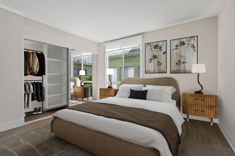 A bedroom with a large bed and a wardrobe.