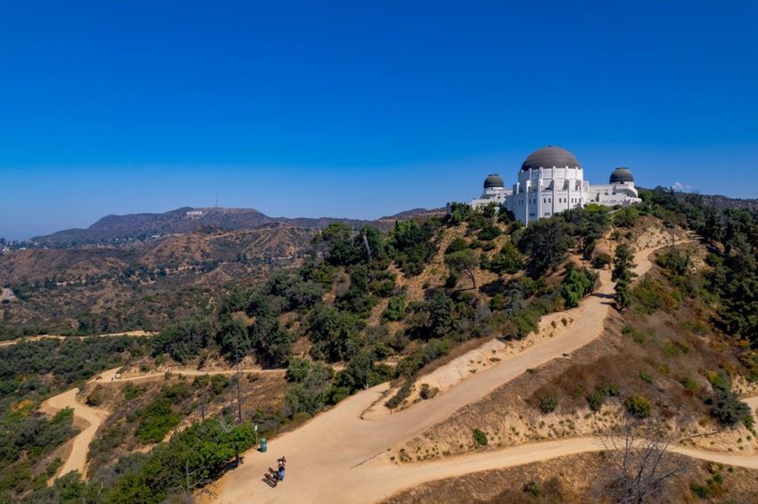 a view of the griffith observatory from the top of a hill