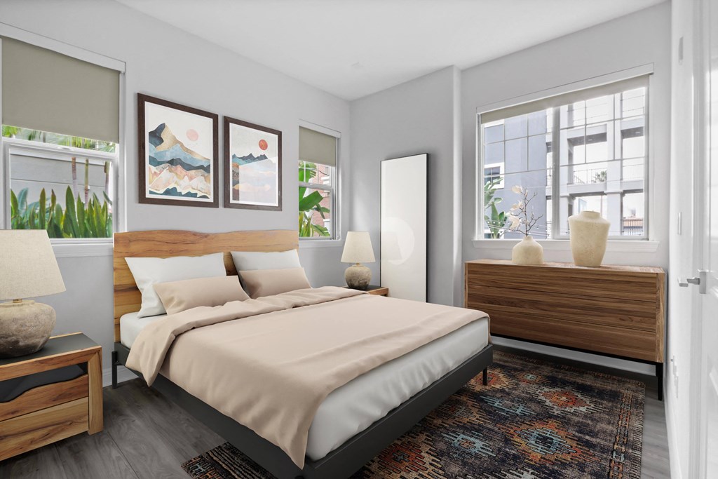 a bedroom with a bed and two windows