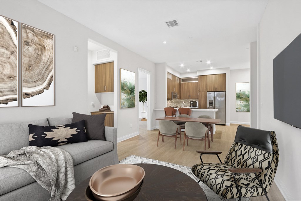 a living room with a couch and a table with chairs