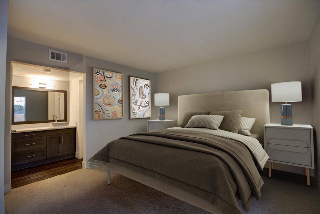 a bedroom with a large bed and a mirror