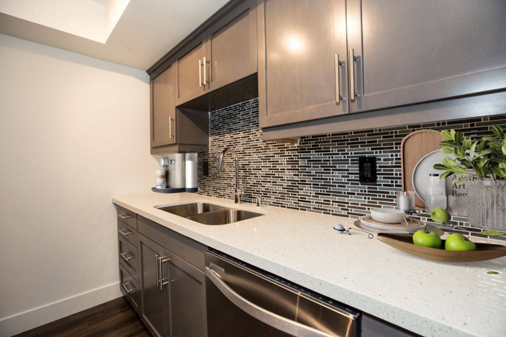 a kitchen with a sink and a counter top