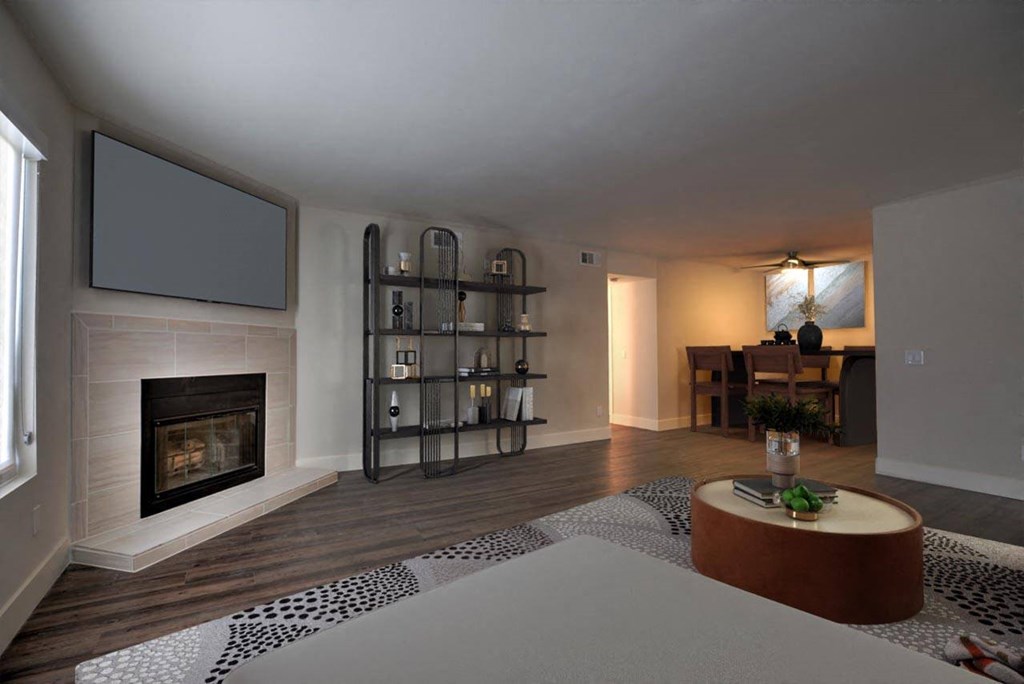 a living room with a fireplace and a table