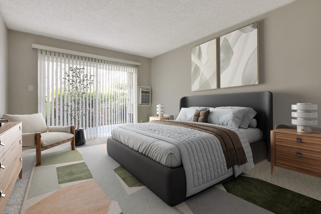 A bedroom with a large bed and a chair by the window at Waverly, Los Angeles, CA
