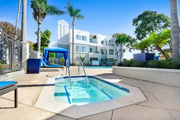 Pool With Relaxing Chairs at Nobel Court, San Diego, CA