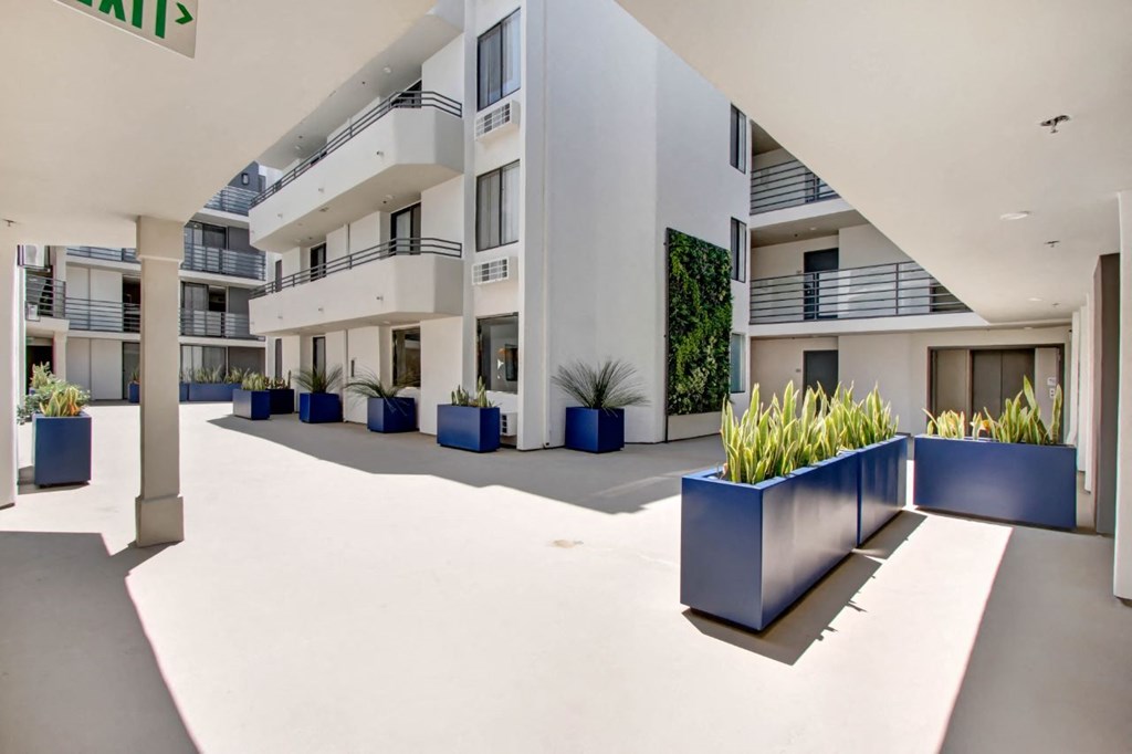 a large white building with a large blue planter in front of it at The Kenmore Los Feliz, Los Angeles, 90027-4063