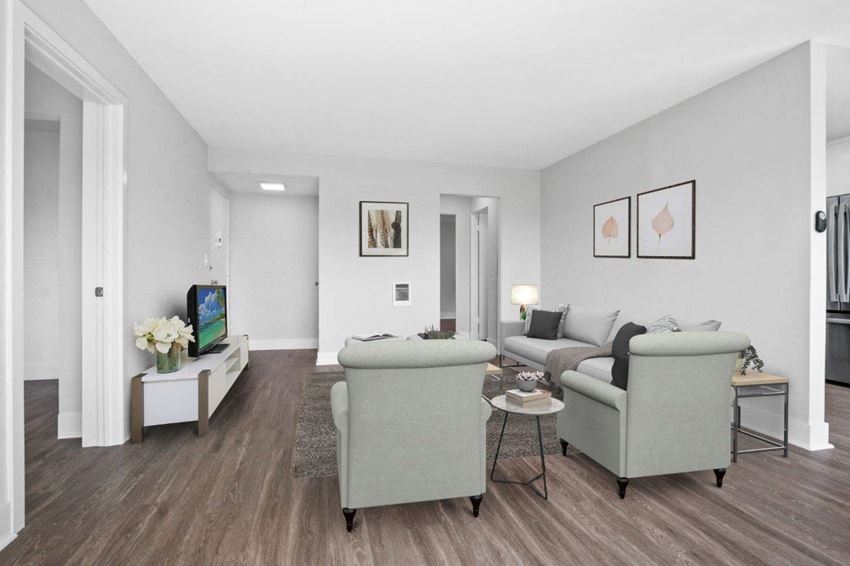 a living room with two couches a coffee table and a tv - Photo Gallery