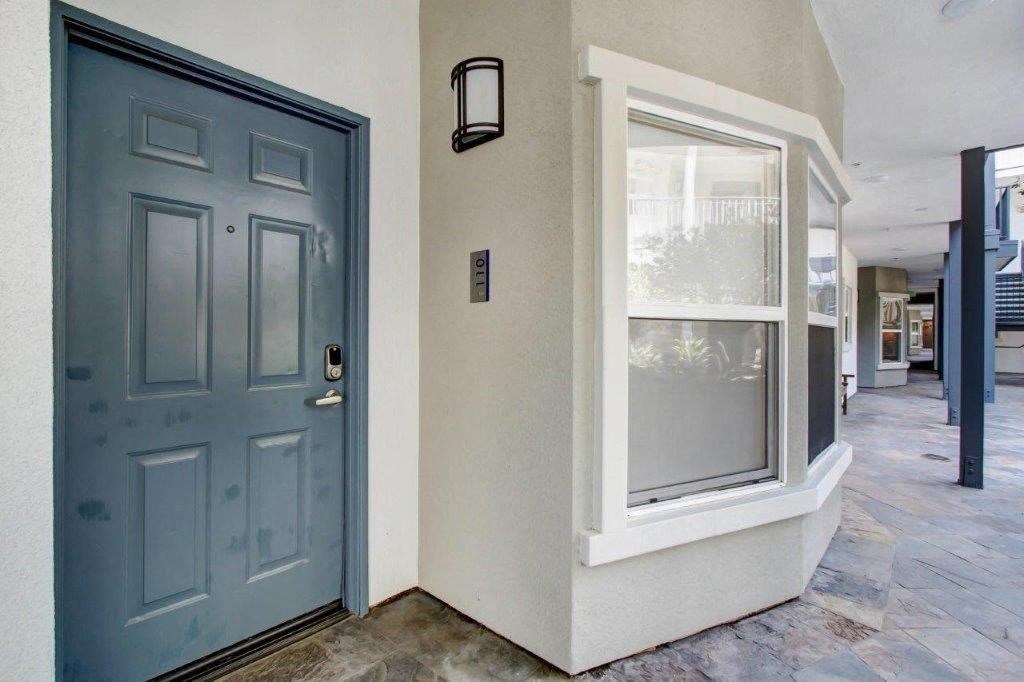 a blue door with a window next to it at Toluca Court, Toluca Lake