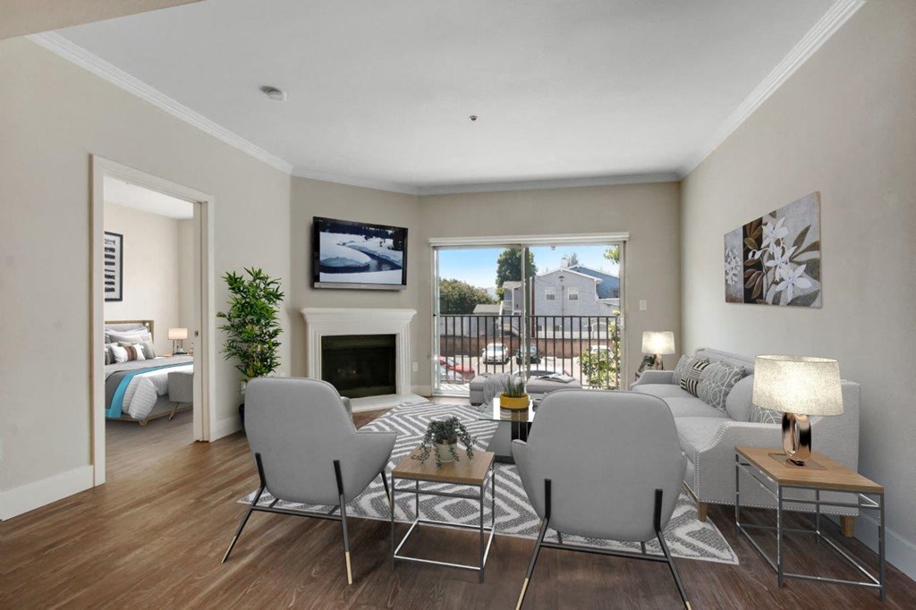 a living room with a couch and two chairs in front of a fireplace 1 at Toluca Court, California, 91602