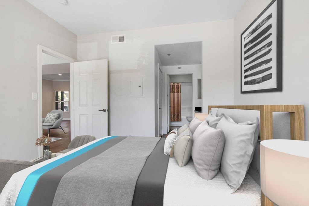 a bedroom with a bed and a chair in a room at Toluca Court, Toluca Lake, California