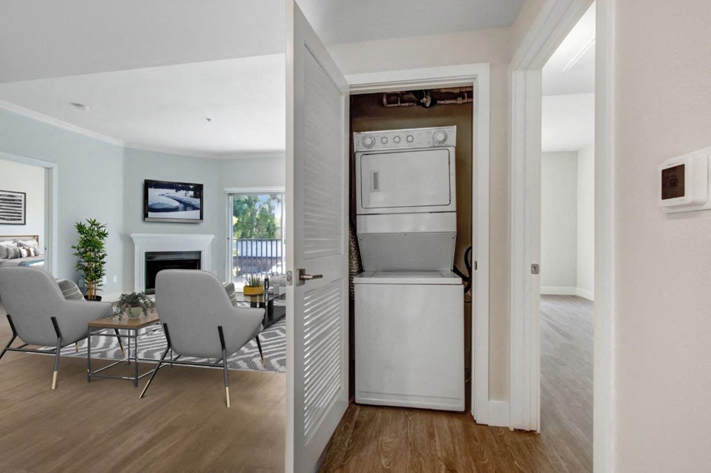 a white washer and dryer in a room with a table and chairs at Toluca Court, Toluca Lake, California