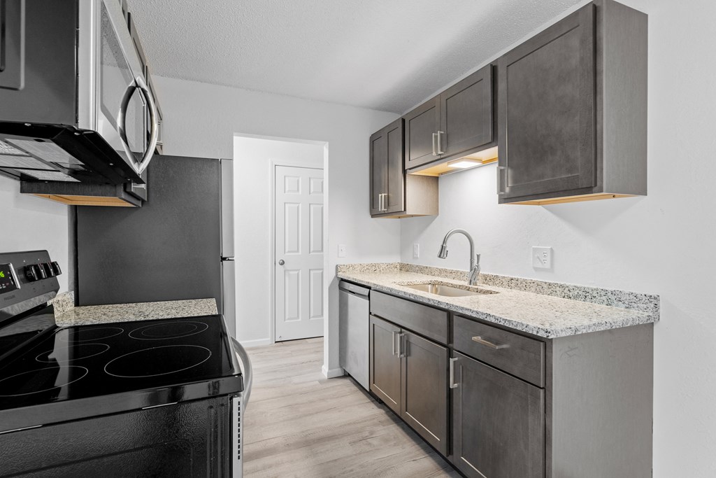 the spacious kitchen of our studio apartment atrium with stainless steel appliances