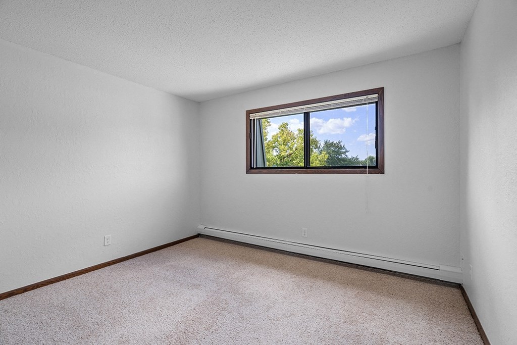 an empty room with a window in it