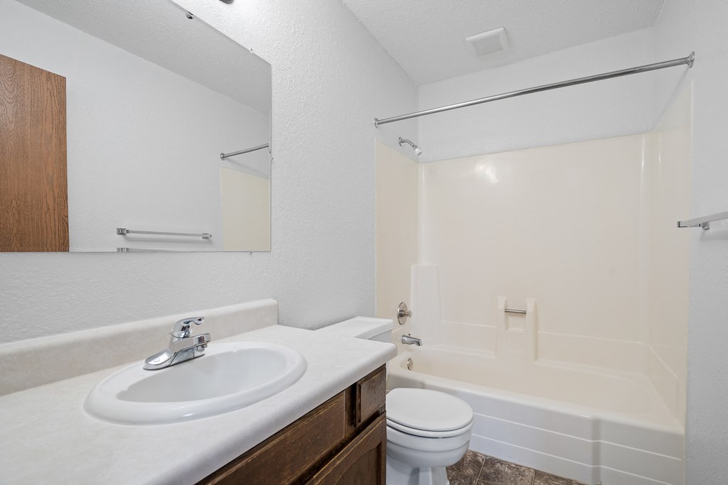 a bathroom with a sink toilet and a tub