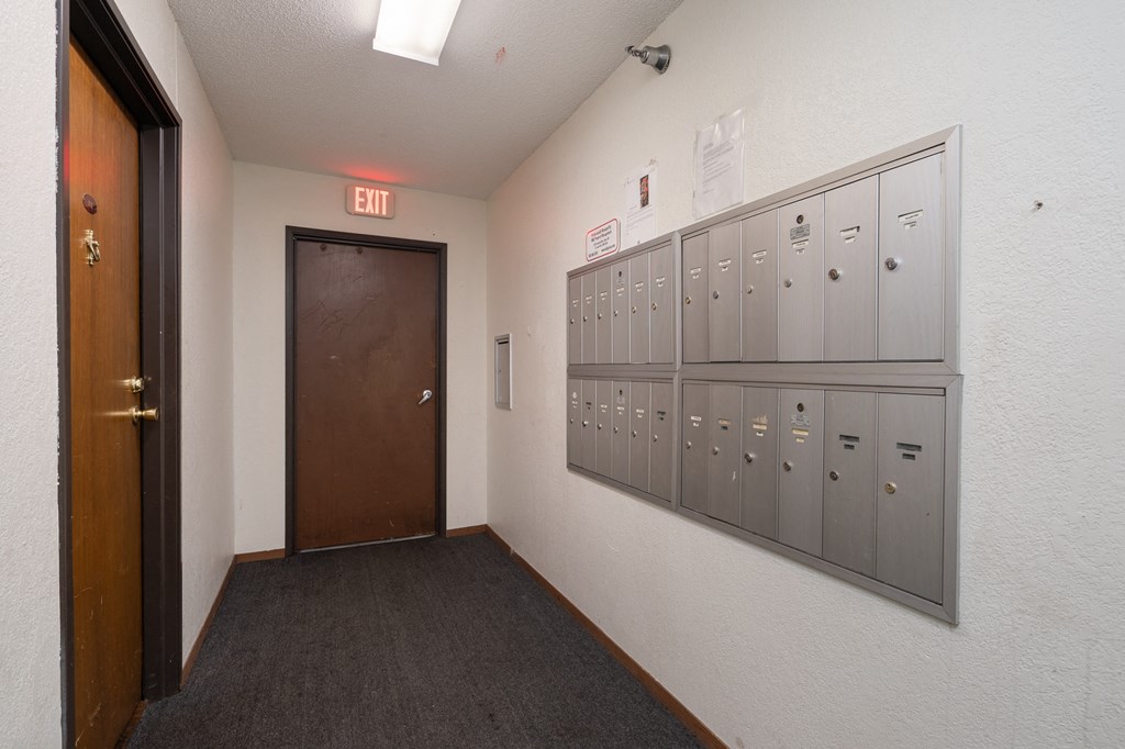the lockers and the door to the locker room of a school