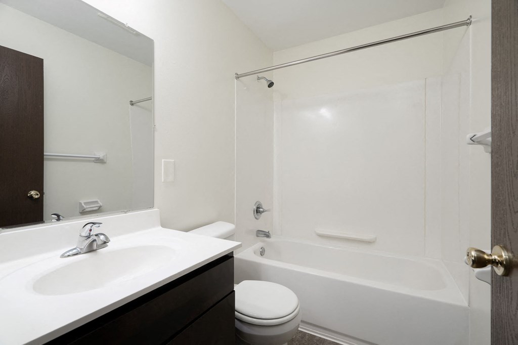 a bathroom with a sink toilet and a shower