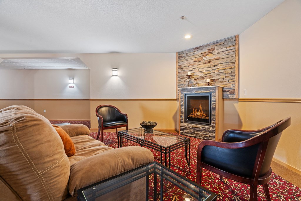 a living room with a fireplace and a couch